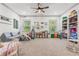 Spacious playroom filled with toys, natural light, and comfortable seating, perfect for activities at 6414 Blue Water Dr, Buford, GA 30518
