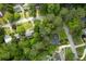 Aerial view of a house nestled among mature trees in a residential neighborhood at 3840 Wieuca Ne Ter, Atlanta, GA 30342