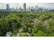 Aerial view of property showing mature trees and proximity to the city. Address 3840 Wieuca Terrace NE at 3840 Wieuca Ne Ter, Atlanta, GA 30342