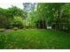 Expansive backyard featuring a lush lawn and privacy fence at 3840 Wieuca Ne Ter, Atlanta, GA 30342