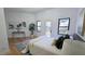 Bright bedroom with walk-out deck, light hardwood floors, large windows, and minimalist decor at 3840 Wieuca Ne Ter, Atlanta, GA 30342