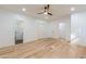 Large bedroom with wood floors, multiple doors, and recessed lighting at 3840 Wieuca Ne Ter, Atlanta, GA 30342
