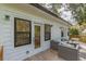 Inviting outdoor deck space with comfortable wicker seating, wood railing, and abundant green tree views at 3840 Wieuca Ne Ter, Atlanta, GA 30342