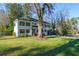 Inviting two-story home with a well-maintained lawn and mature landscaping at 3840 Wieuca Ne Ter, Atlanta, GA 30342