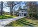 Charming two-story home with a well-manicured lawn and a long driveway at 3840 Wieuca Ne Ter, Atlanta, GA 30342