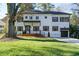 Charming two-story home boasts a welcoming front porch and well-manicured lawn with mature trees at 3840 Wieuca Ne Ter, Atlanta, GA 30342