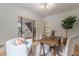 Bright home office with chairs, artwork, a houseplant, and glass doors leading to other rooms at 3840 Wieuca Ne Ter, Atlanta, GA 30342