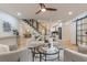 Bright and airy living room featuring hardwood floors, modern decor, and an open staircase at 3840 Wieuca Ne Ter, Atlanta, GA 30342