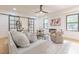 Stylish living room showcasing a decorative fireplace, sleek furnishings, and large windows for natural light at 3840 Wieuca Ne Ter, Atlanta, GA 30342