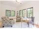 Well-lit home office featuring modern decor, a large desk, and large windows with exterior views at 3840 Wieuca Ne Ter, Atlanta, GA 30342