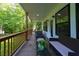 Wide angle view of the covered porch featuring outdoor seating and view of the yard at 3840 Wieuca Ne Ter, Atlanta, GA 30342