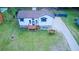 Expansive aerial view of the home with a spacious yard, driveway, and exterior details at 4270 Mountain Glen Trce, Snellville, GA 30039