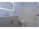Stylishly updated bathroom with a modern vanity, illuminated mirror, and a shower-tub combination at 4270 Mountain Glen Trce, Snellville, GA 30039