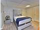 Bedroom with a large upholstered headboard and comfortable linens at 4270 Mountain Glen Trce, Snellville, GA 30039