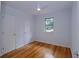 Bright bedroom features a ceiling fan, wood floor, and a window with natural light and has two large closets at 4270 Mountain Glen Trce, Snellville, GA 30039