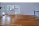 Large living room with hardwood floors, natural light, views to the kitchen and access to the backyard at 4270 Mountain Glen Trce, Snellville, GA 30039