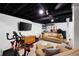 Finished basement area provides versatile living with media and exercise space at 6005 Cherecobb Ln, Woodstock, GA 30188