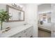 Bright bathroom featuring a vanity with countertop space and view into the bedroom at 6005 Cherecobb Ln, Woodstock, GA 30188