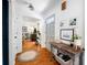 Bright entryway features hardwood floors, decorative table, and views into the living room at 6005 Cherecobb Ln, Woodstock, GA 30188