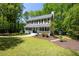 Charming two-story home with inviting front porch and landscaped front yard at 6005 Cherecobb Ln, Woodstock, GA 30188