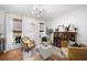 Bright and airy living room with stylish furniture, decorative rug, and natural light at 6005 Cherecobb Ln, Woodstock, GA 30188