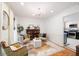 Cozy living room with hardwood floors, natural light, and comfortable seating arrangement at 6005 Cherecobb Ln, Woodstock, GA 30188