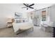 Bright main bedroom with a ceiling fan, neutral decor, and ample natural light at 6005 Cherecobb Ln, Woodstock, GA 30188