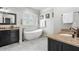 Luxurious bathroom with a freestanding tub, double vanity, and modern fixtures at 631 Boulevard Ne, Atlanta, GA 30308