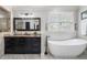 Stylish bathroom featuring a soaking tub, dark wood vanities, and contemporary design at 631 Boulevard Ne, Atlanta, GA 30308