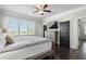 Bedroom with hardwood floors, ceiling fan, natural light, and dark wood accents at 631 Boulevard Ne, Atlanta, GA 30308
