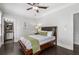 Bedroom features hardwood floors, a ceiling fan, natural light, and ensuite bath access at 631 Boulevard Ne, Atlanta, GA 30308