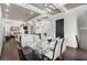 Open-concept design showcasing the dining area with a glass-top table and modern finishes throughout at 631 Boulevard Ne, Atlanta, GA 30308