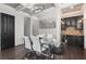 Elegant dining room with coffered ceilings, a bar area, and a glass-top table for sophisticated entertaining at 631 Boulevard Ne, Atlanta, GA 30308