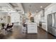 Spacious kitchen featuring a large marble island with seating, stainless steel appliances, and hardwood floors at 631 Boulevard Ne, Atlanta, GA 30308