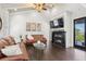 Cozy living room boasts a fireplace, hardwood floors, and comfortable leather sofas at 631 Boulevard Ne, Atlanta, GA 30308