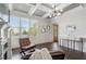Bright and airy living room featuring a fireplace, stylish decor, and coffered ceilings at 631 Boulevard Ne, Atlanta, GA 30308