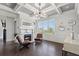 Cozy living room with a fireplace, dark hardwood floors, and views of the city skyline at 631 Boulevard Ne, Atlanta, GA 30308