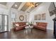 Open living room featuring hardwood floors, leather sofas, modern decor, and coffered ceilings at 631 Boulevard Ne, Atlanta, GA 30308