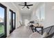 Bright living space with access to outdoors, gray tile floor, fan, and comfortable chairs at 631 Boulevard Ne, Atlanta, GA 30308