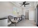 Bright living space with modern gray tile floor, fan, mini-fridge, and comfortable chairs at 631 Boulevard Ne, Atlanta, GA 30308