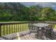 Back deck with outdoor dining table and a view of the yard at 24 Autry Road, Auburn, GA 30011