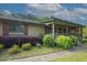A welcoming view of a cozy home with attractive landscaping and a covered entrance at 24 Autry Road, Auburn, GA 30011