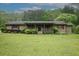 Charming single-story home with a covered front porch and well-maintained landscaping at 24 Autry Road, Auburn, GA 30011