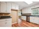 Bright kitchen featuring stainless appliances, updated flooring, and convenient layout at 24 Autry Road, Auburn, GA 30011