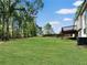 Spacious backyard featuring a well-maintained lawn and a wooden deck, offering ample space for outdoor gatherings at 319 Primrose Ln, Auburn, GA 30011