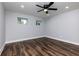 A modern bedroom with wood floors, recessed lighting, and a ceiling fan at 319 Primrose Ln, Auburn, GA 30011