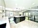 Beautiful kitchen island with white countertop and dark cabinets, and stainless steel wine cooler at 319 Primrose Ln, Auburn, GA 30011