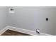 A gray painted wall in a laundry room featuring a laundry hookup at 319 Primrose Ln, Auburn, GA 30011