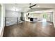An open layout showcasing hardwood floors, a modern railing, and a stylish kitchen island at 319 Primrose Ln, Auburn, GA 30011