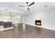 Inviting living space featuring hardwood floors, a stone fireplace, and an open layout with abundant natural light at 319 Primrose Ln, Auburn, GA 30011